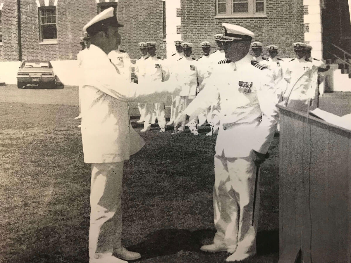 a black and white photo of Walter Twidwell in uniform during his Navy service